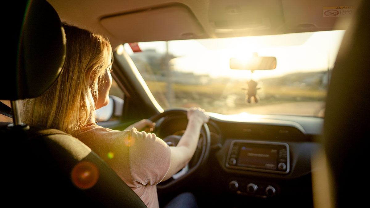 A person driving a car

Description automatically generated